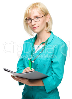 Portrait of a woman wearing doctor uniform