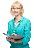 Portrait of a woman wearing doctor uniform