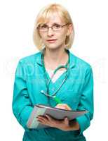 Portrait of a woman wearing doctor uniform