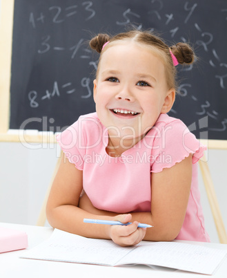 Portrait of a little girl in school