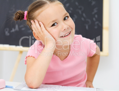 Portrait of a little girl in school