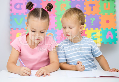 Children are writing on their books