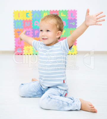 Children are sitting on floor