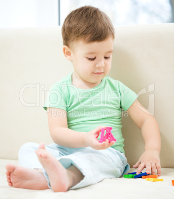 Little boy playing with toys