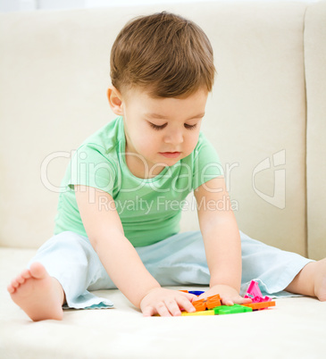 Little boy playing with toys