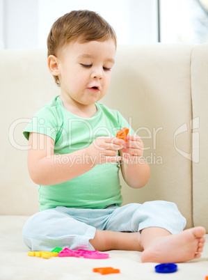 Little boy playing with toys