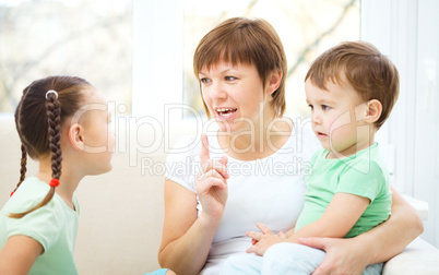 Mother talking to her children
