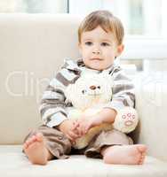 Portrait of a little boy with his teddy bear