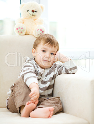 Portrait of a little boy with his teddy bear