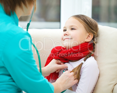 Doctor is examining little girl using stethoscope
