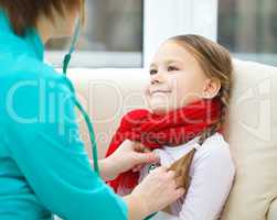 Doctor is examining little girl using stethoscope