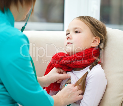 Doctor is examining little girl using stethoscope