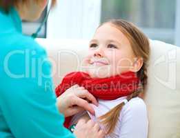 Doctor is examining little girl using stethoscope