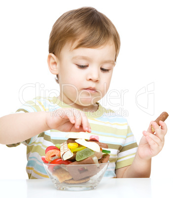 Portrait of a boy with candies