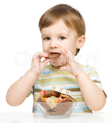 Portrait of a boy with candies