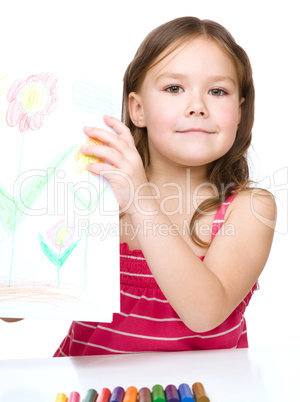 Little girl is showing her drawing