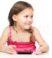 Little girl is using calculator