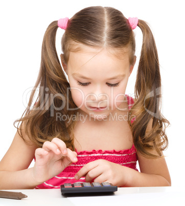 Little girl is using calculator