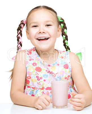 Cute little girl with a glass of milk