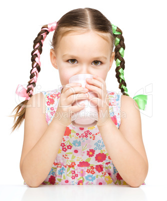 Cute little girl with a glass of milk