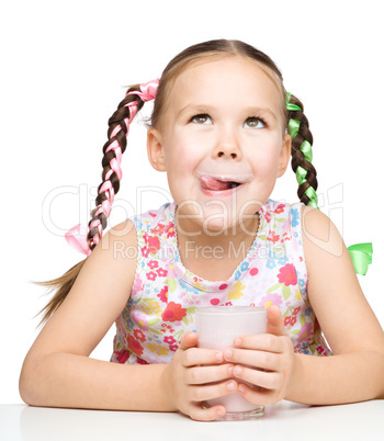 Cute little girl with a glass of milk