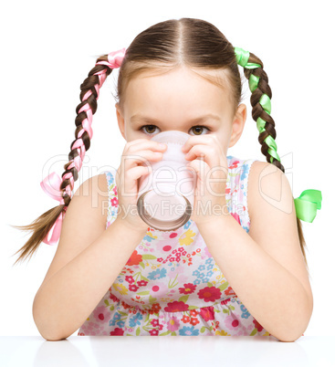 Cute little girl with a glass of milk