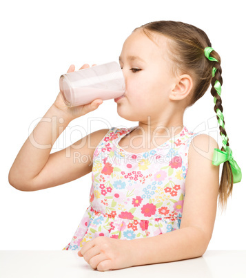 Cute little girl with a glass of milk