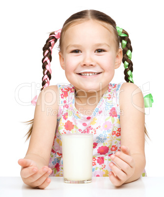 Cute little girl showing milk moustache