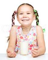 Cute little girl showing milk moustache