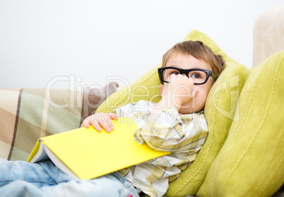 Little boy is reading book