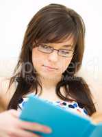 Woman is reading a book