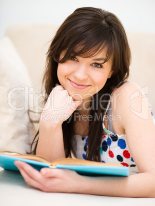 Woman is reading a book