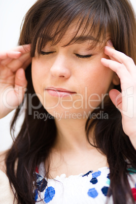 Woman is suffering headache