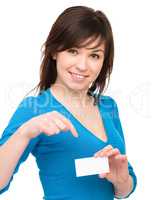 Young woman is holding visit card