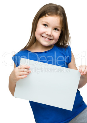 Little girl is holding blank banner