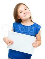 Little girl is holding blank banner