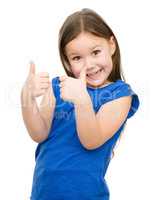Little girl is showing thumb up gesture