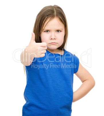 Little girl is showing thumb up gesture