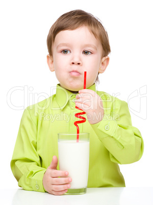 Cute little boy with a glass of milk