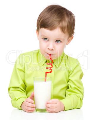 Cute little boy with a glass of milk