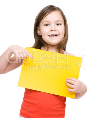 Little girl is holding blank banner