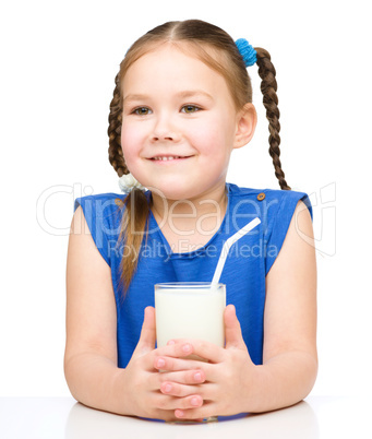 Cute little girl with a glass of milk