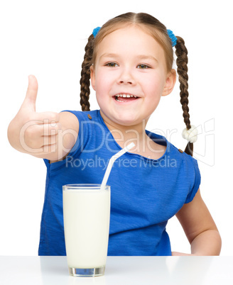 Cute little girl with a glass of milk