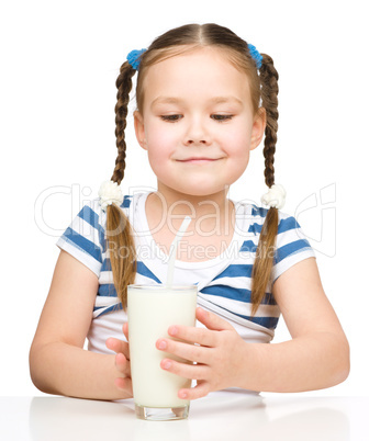 Cute little girl with a glass of milk