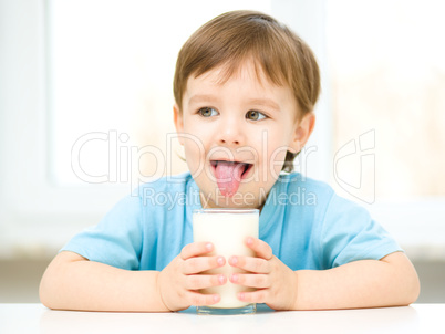 Cute little boy with a glass of milk