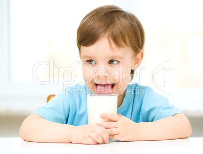 Cute little boy with a glass of milk