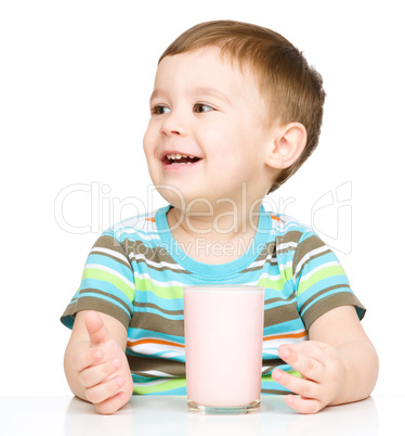 Cute little boy with a glass of milk