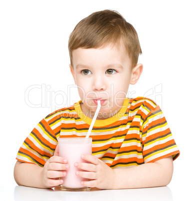 Cute little boy with a glass of milk