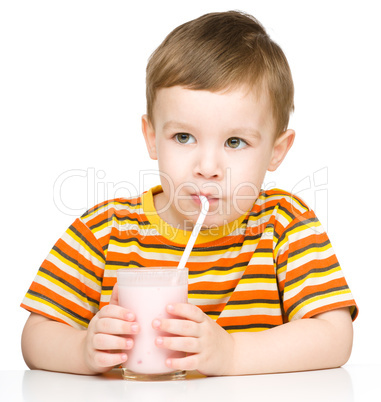 Cute little boy with a glass of milk