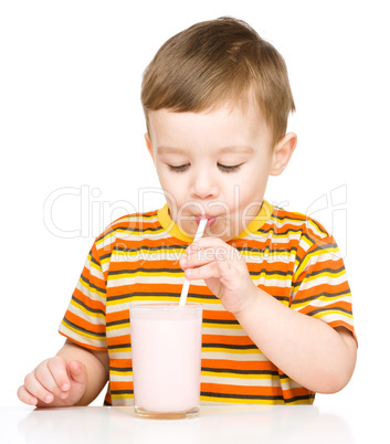 Cute little boy with a glass of milk